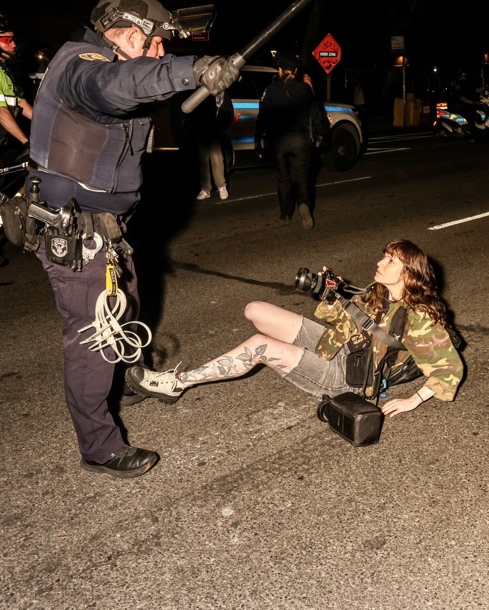 Hell of a photo by @AlexKentTN, capturing the moment @olgafe_images, a credentialed journalist, is arrested by the NYPD.