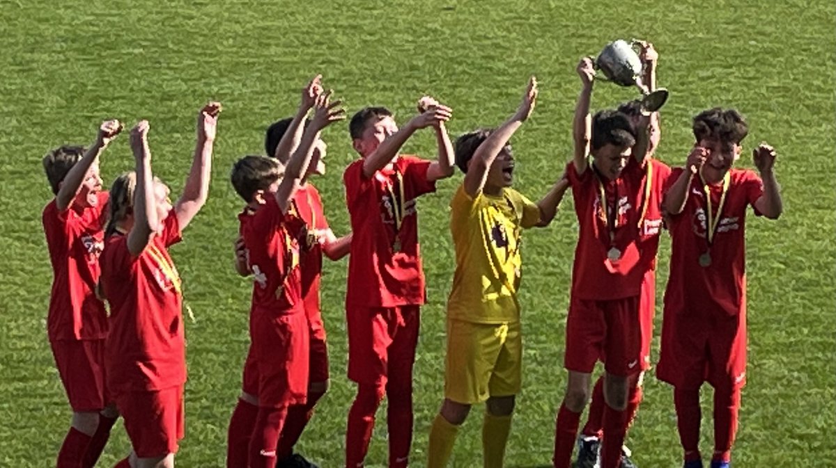 Larkfield football team celebrating lifting the Loveridge cup at Haig Avenue v St Philips today.