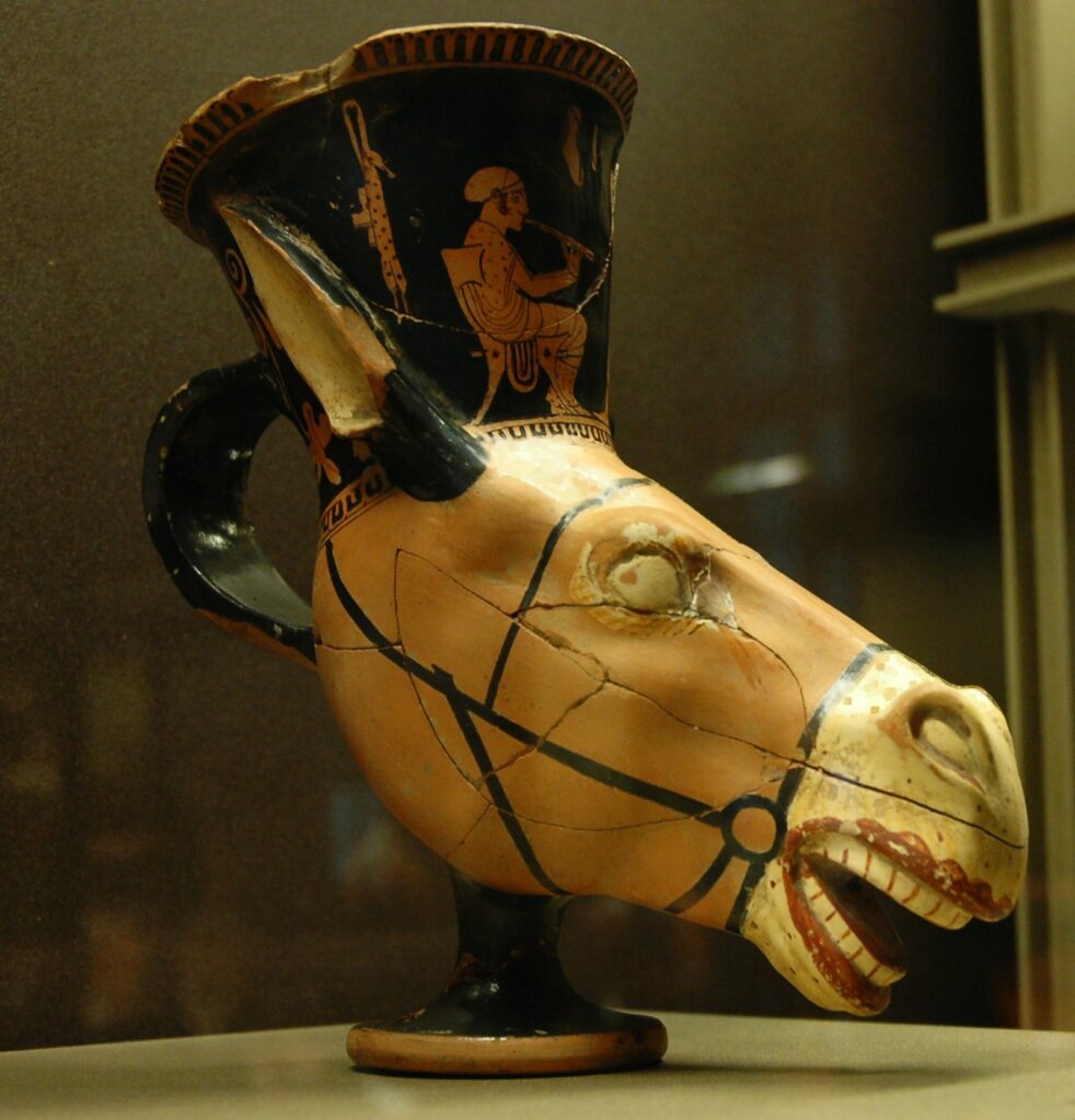 #InternationalDonkeyDay A donkey shaped rhyton that is the stuff of nightmares! The 'lipsticked' mouth, the rolling eyes...fit for a wild Dionysian feast😳 Athenian donkey's head rhyton, representing a musician and a dancer, ca. 470 BC–460 BC. Louvre Museum, Paris.