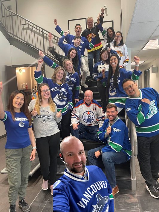 Our Van office is showing their support for the @Canucks today, gearing up for the playoff game against the Edmonton Oilers. Go Canucks! Can you spot the traitor? 🏒 #OnlyatOppy #Canucks #AllTogether