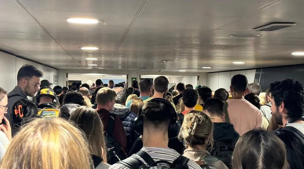 Passport e-gates outage at UK airports sees under-pressure staff leave thousands of people to queue for hours in corridors – a procedure known as the 'NHS approach'