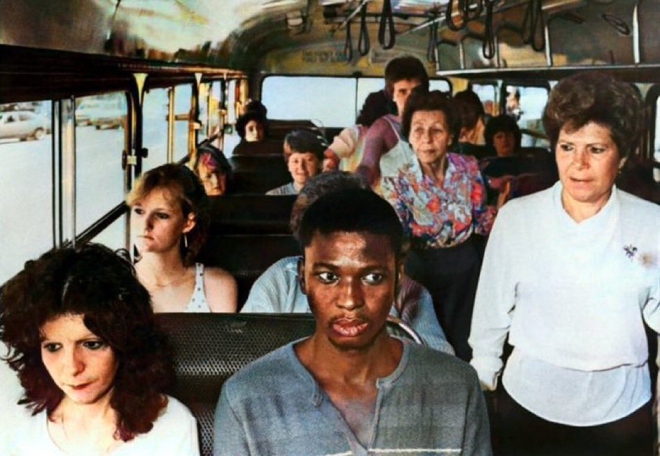 A man rides a bus in Durban, meant for white passengers only, in resistance to South Africa's apartheid policies, 1986.