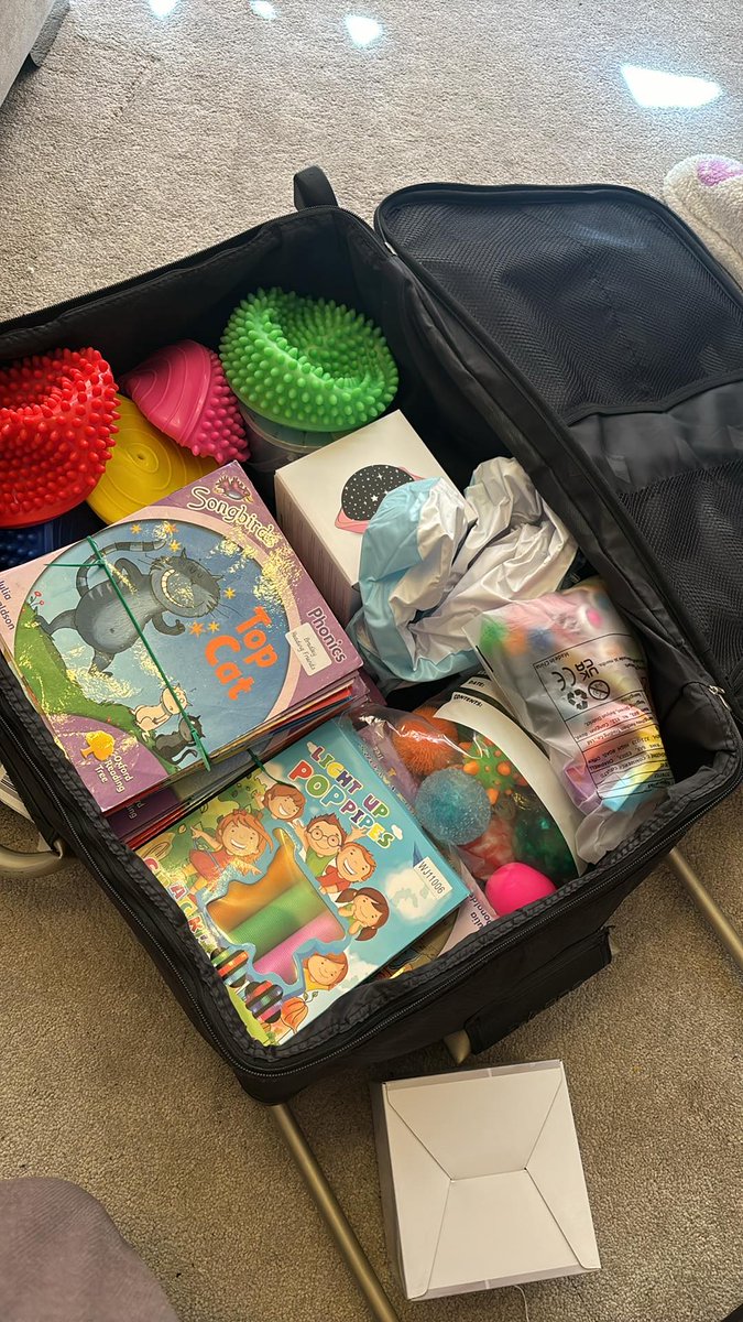Suitcase number one packed with sensory equipment and phonics books. It doesn't look full but it is up to it's weight limit!  We still need a few more bits if anyone can help. Especially the #teacher books. amazon.co.uk/hz/wishlist/ls…