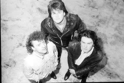 The Unholy Trinity, on a roof on St George's Road, if I recall correctly. 1985.