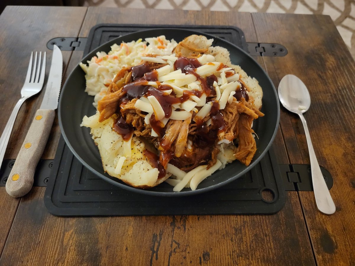 [Date Night Food]

Baked potato covered in pulled pork BBQ with coleslaw.
Mmmmmmmmmm.

(This thing is massive.)