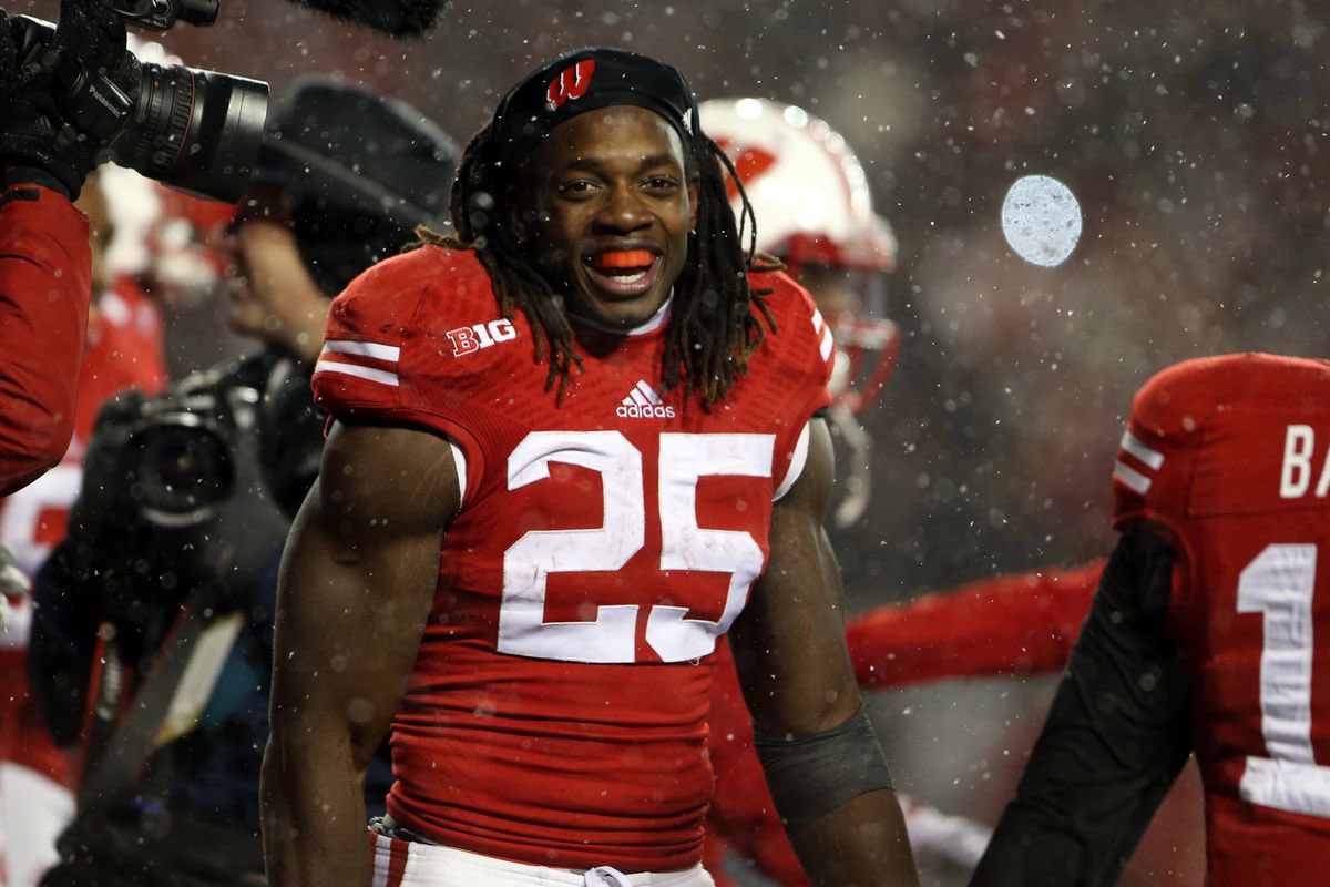 IMO, Melvin Gordon has the best rushing performance in the history of CFB for 2 reasons: 
1. It was against the 16th ranked team in the nation (Nebraska)
2. Did it in 3rd quarters 

Perine did it in 4 full quarters against the worst team P5 team that year