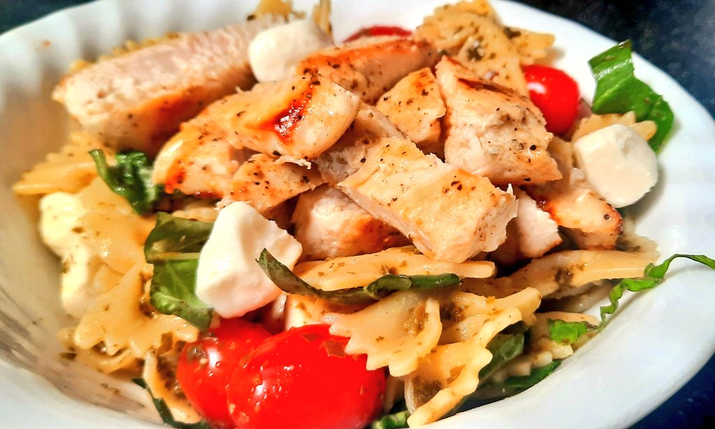 Imagine a caprese salad mixed with pesto chicken pasta.