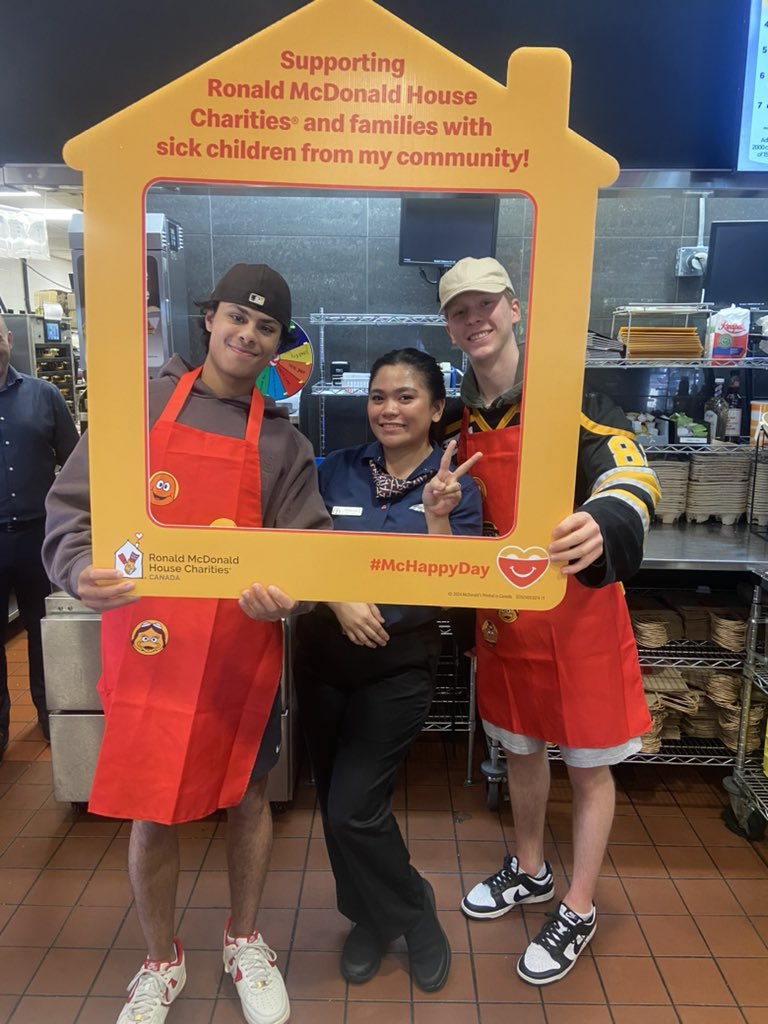 Shaan Mann and Nate Crema helping out at McHappy Day to raise money for local charities, KidSport Tri-Cities and Ronald McDonald House.