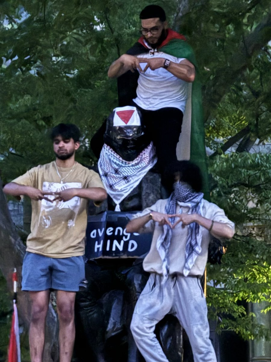Right now @penn three individuals deface the Ben Franklin statue while putting up the Hamas upside triangle. This triangle is Hamas’s symbol for who they murder. They also put up “avenge Hind” in reference to Columbia. How is @penn allowing this?