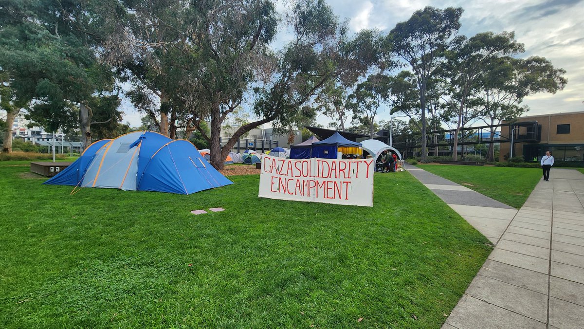 On the way to class. There have been accusations of the Monash encampment restricting the movement of Jewish students. This is simply untrue. The encampment occupies a small part of the lawn allowing for access to the footpaths to move. Its like walking across the rug of a family…