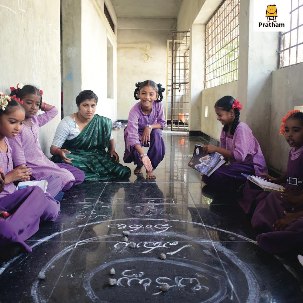 At Pratham, children learn through play-based activities. One such activity is the 'Sankhya Chakra', a game to teach place value to children. It's a hands-on way to understand numbers and develop Math skills. #pratham #ngo