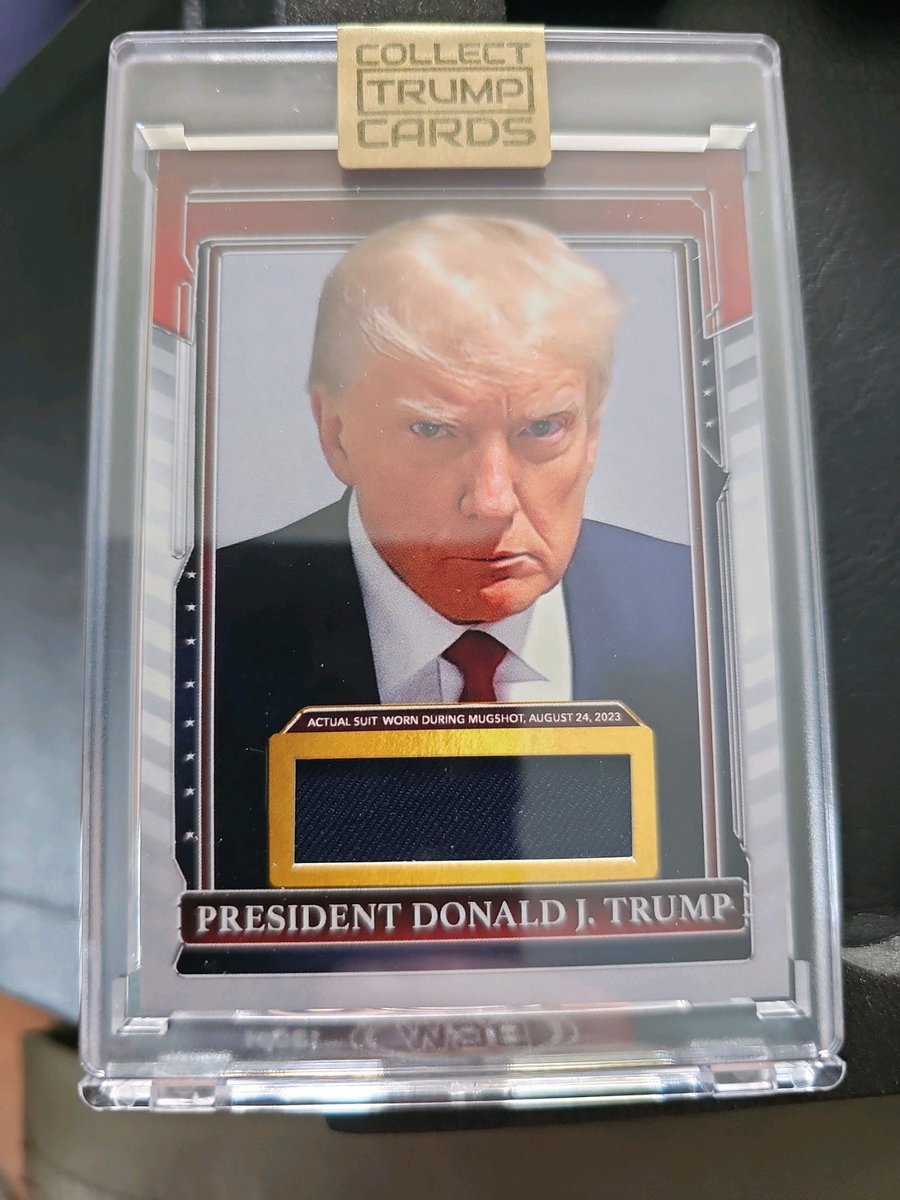 There it is, folks. A piece of the suit that Trump was arrested in for the GA RICO case. Had to buy every Trump NFT to get one. Big bucks for this gem.