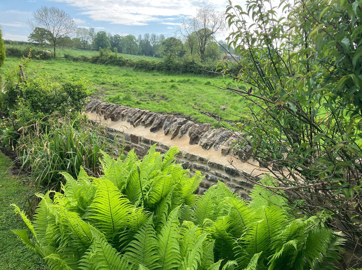 Cottage boundary wall, village setting, rebuilt to replicate the appearance of the original centuries old wall, built using 100 % recycled walling stone, maintaining the regional pattern of English building for everyone to enjoy, Fitzwilliam Wentworth Estate.