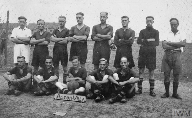 The 'Aston Villa' football team, made of British POWs, photographed at Stalag XXID, the German prisoner-of-war camp in Poznań (Posen), Poland. Football was a popular form of recreation for British POWs. Read more here: bit.ly/3wm3A0J © IWM (HU 9282)