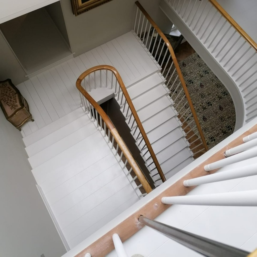 We are loving how the white balustrade and flooring complements the bespoke oak handrails - so bright and airy.