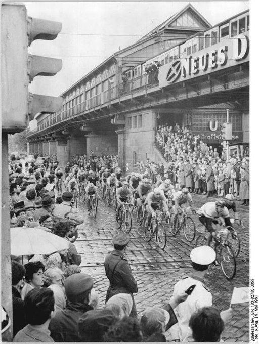 9 May 1961: the seventh stage of the 'Friedensfahrt' cycle race reaches the corner of Schönhauser Allee and Dimitroffstraße in East Berlin (via Bundesarchiv)