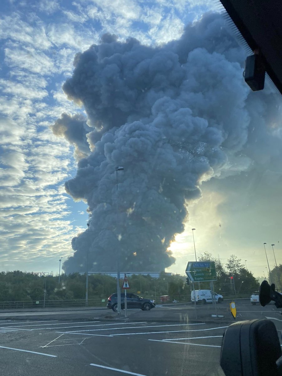 Time4Cannock's tweet image. Fire at industrial estate the rear of Sainsbury's Cannock 
A serious fire broke out earlier this morning in an industrial unit, fire crews are on the scene
I advise traffic to avoid the Orbital area, #M6Toll #A5 
not far from #McArthurGlen 
#Cannock #CannockChase #Staffordshire