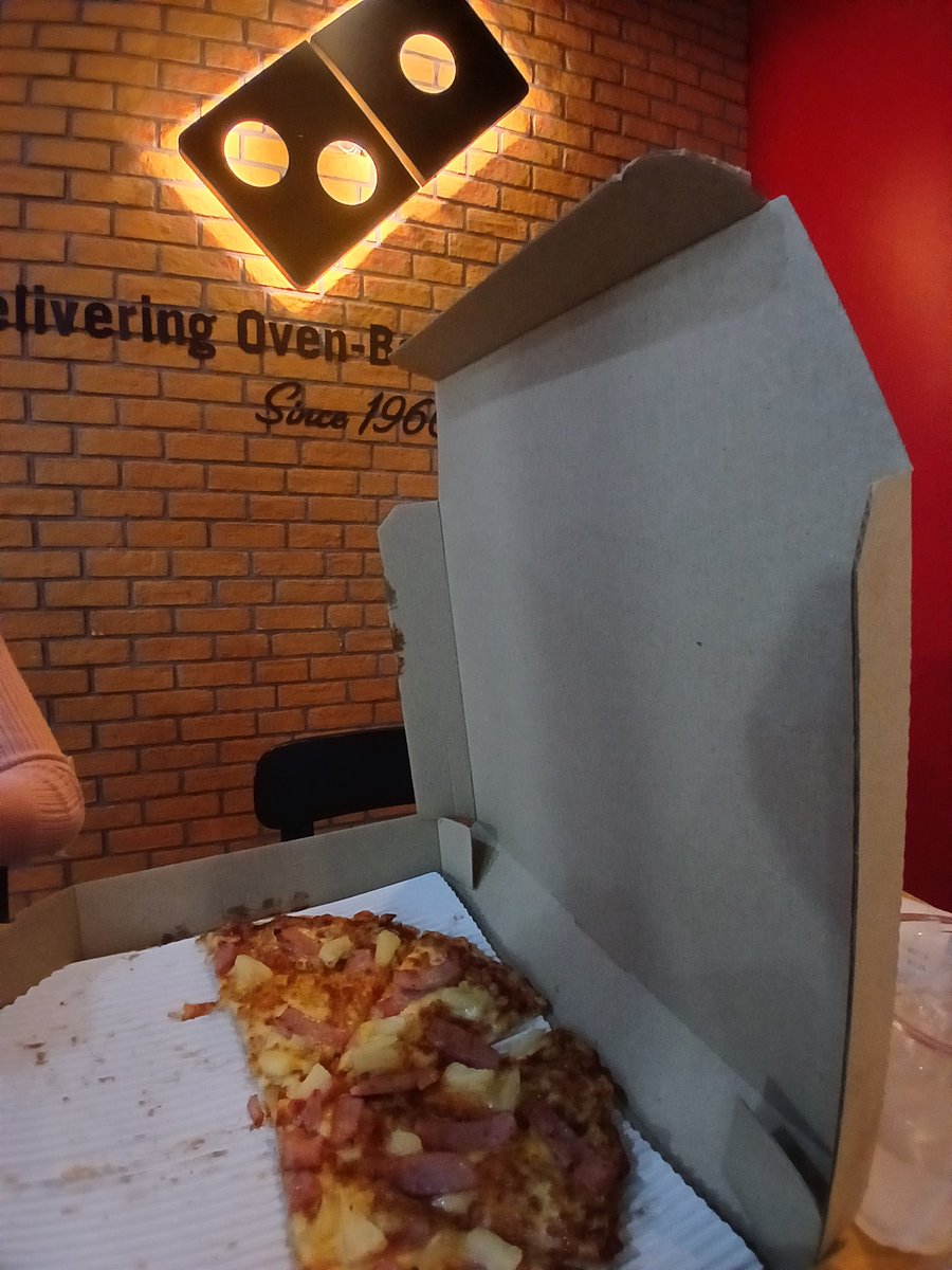 Hawaiian pizza at Domino's in Major Nonthaburi, just outside Bangkok, Thailand Pizza quality is slightly better than in US No parmesan cheese or garlic powder available Served with oregano flake and red pepper powder packets and ... Ketchup packets You know it's love when…
