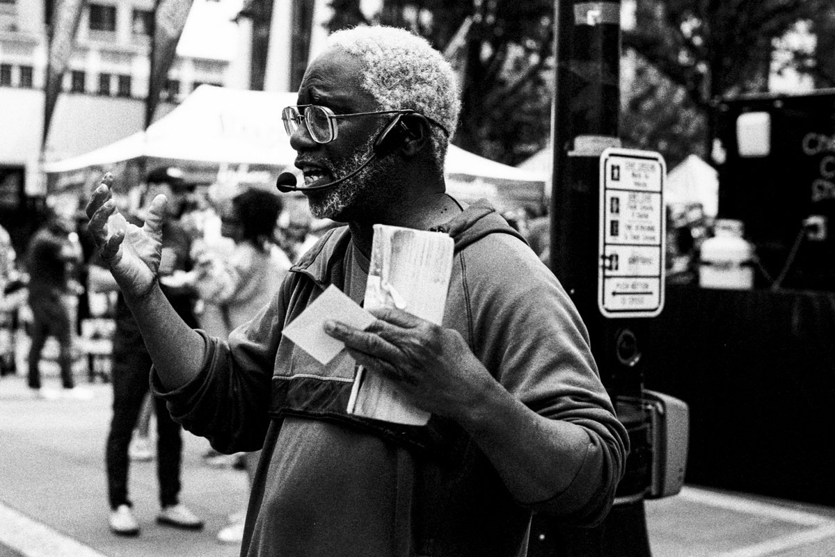 Fayetteville Street Sermon Camera: Nikon F4 & 50mm Film: #ilfordphoto HP5 1600 & ID-11 Location: Raleigh, North Carolina USA #believeinfilm #photography #filmphotography #ilfordHP5 #streetphotography