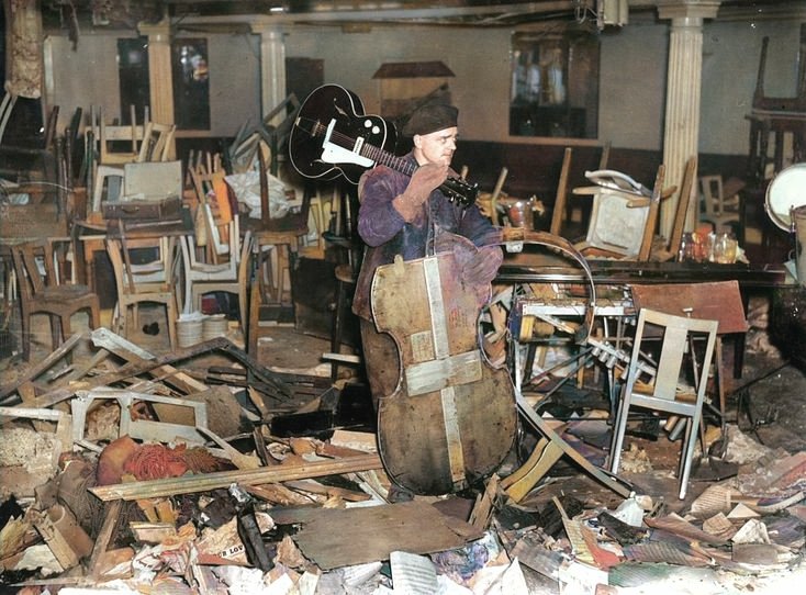 Saturday 8 March 1941, the Café de Paris, on Coventry Street, a London nightclub & restaurant was bombed during the Blitz. A picture of a man retrieving an intact guitar, I can't help thinking if it was ever played again and who has it now!