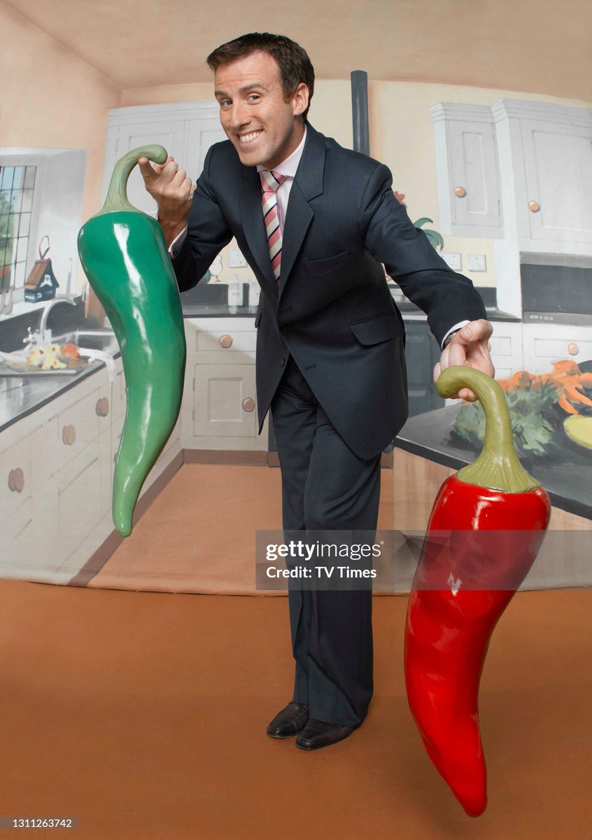 Television presenter and dancer Anton Du Beke posed with giant chilli peppers (2008)