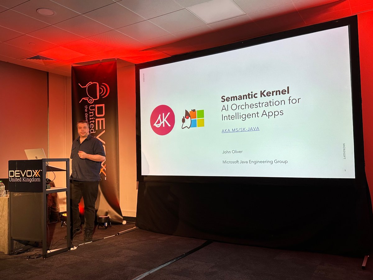 Now on stage John Oliver talking about building AI-powered Java applications with Semantic Kernel. #DevoxxUK