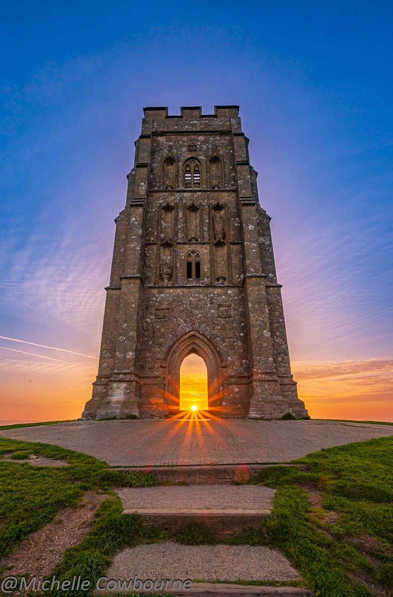 Tower of strength and light. Sunrise from this morning on Glastonbury Tor. The sun is currently rising central archway in St Michael's tower.