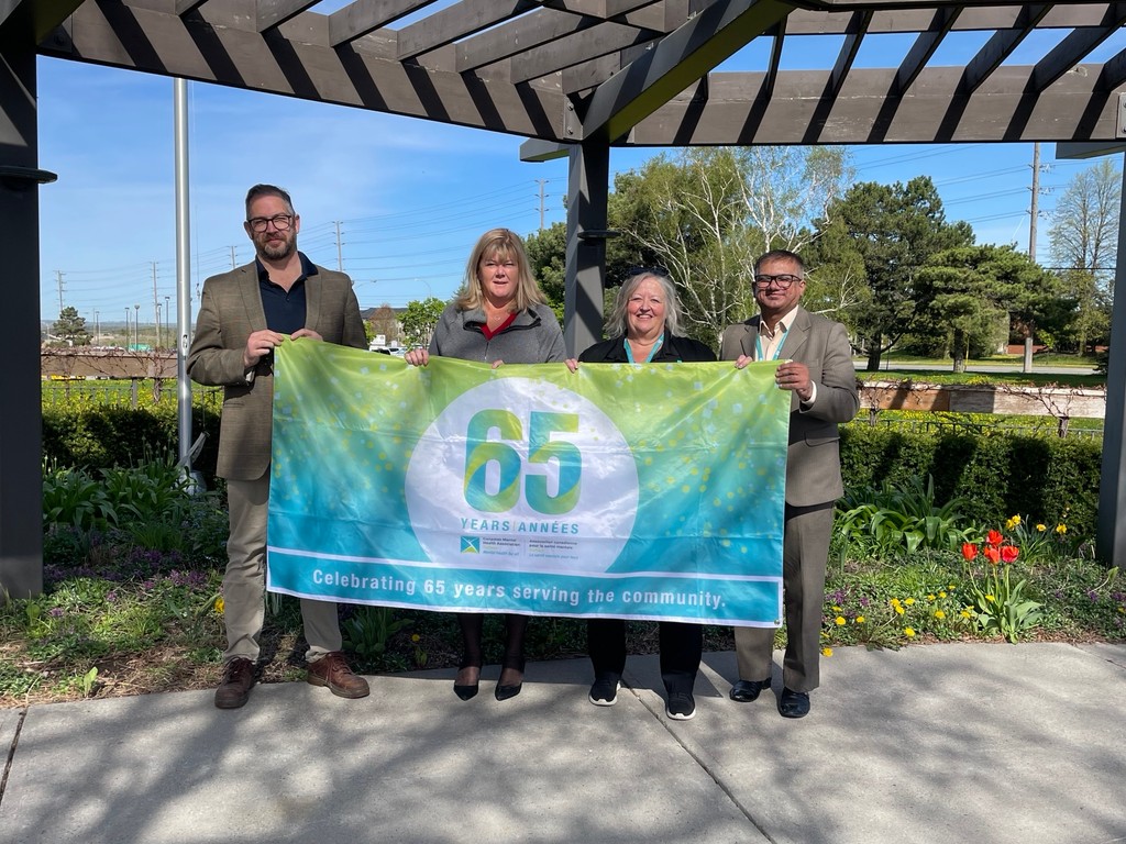 As part of our 65th anniversary, we are celebrating Mental Health with flag raisings across Durham Region. On Monday Marsha Coombs, Performance Manager Programs, Partnerships & Ethics joined Whitby Mayor Elizabeth Roy, and Staff in raising the flag at city hall.