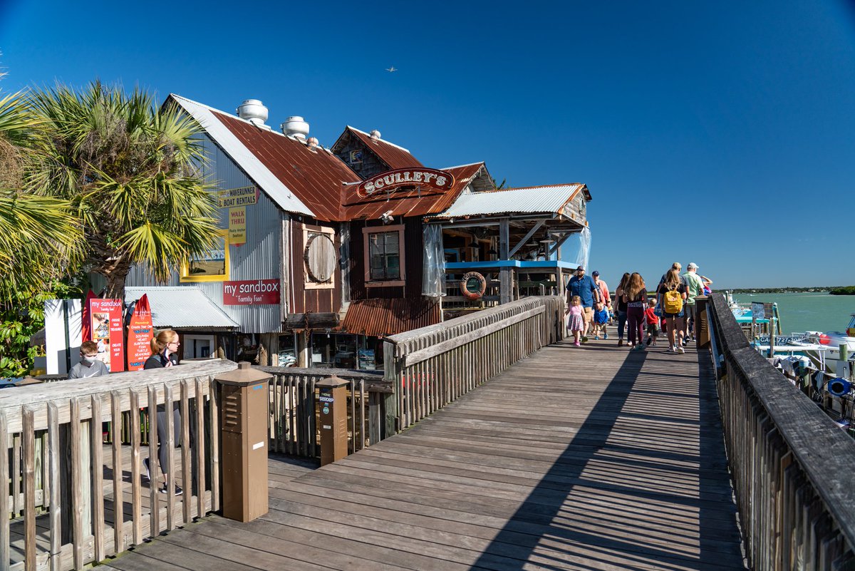 It's a picture-perfect day for a stroll around Johns Pass Village & Boardwalk! What are some of your favorite shops and restaurants to visit at this Madeira Beach icon? 🎣☀️🌴  #JohnsPass #MadeiraBeach