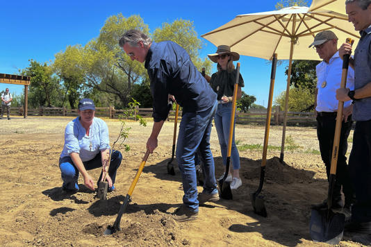 'Gavin Newsom is coming for your car, and he wants you to know it!!!!! CA Gov. Newsom breaks ground at a new California state park on April 22, 2024, at the Dos Rios property, in Modesto, California. He's cutting planet-warming emissions on natural lands.'
