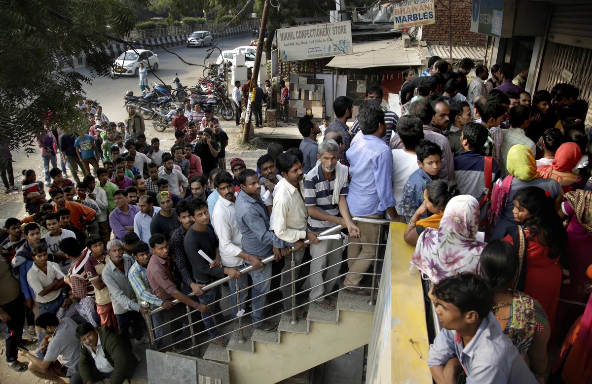 2016 : People standing in queue to get their own money after demonetization