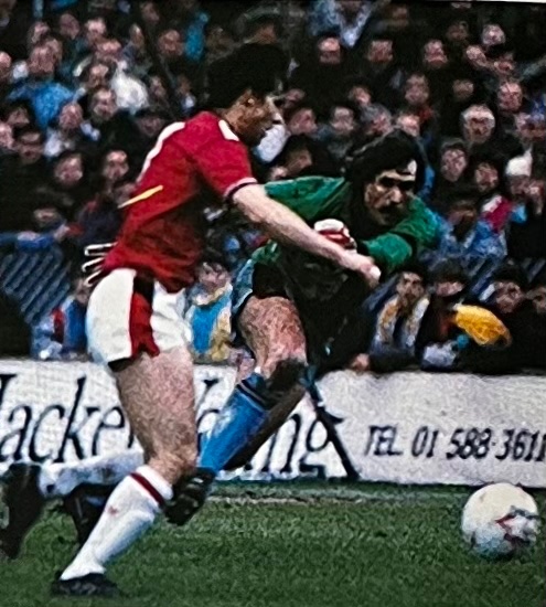 18/2/89. After a long lay off through injury Phil Parkes comes back into the side to help us defeat Charlton 1-0 at Selhurst Park in the FAC 5th round tie. Here he comes out to smother the danger posed by Addicks midfielder Steve MacKenzie.