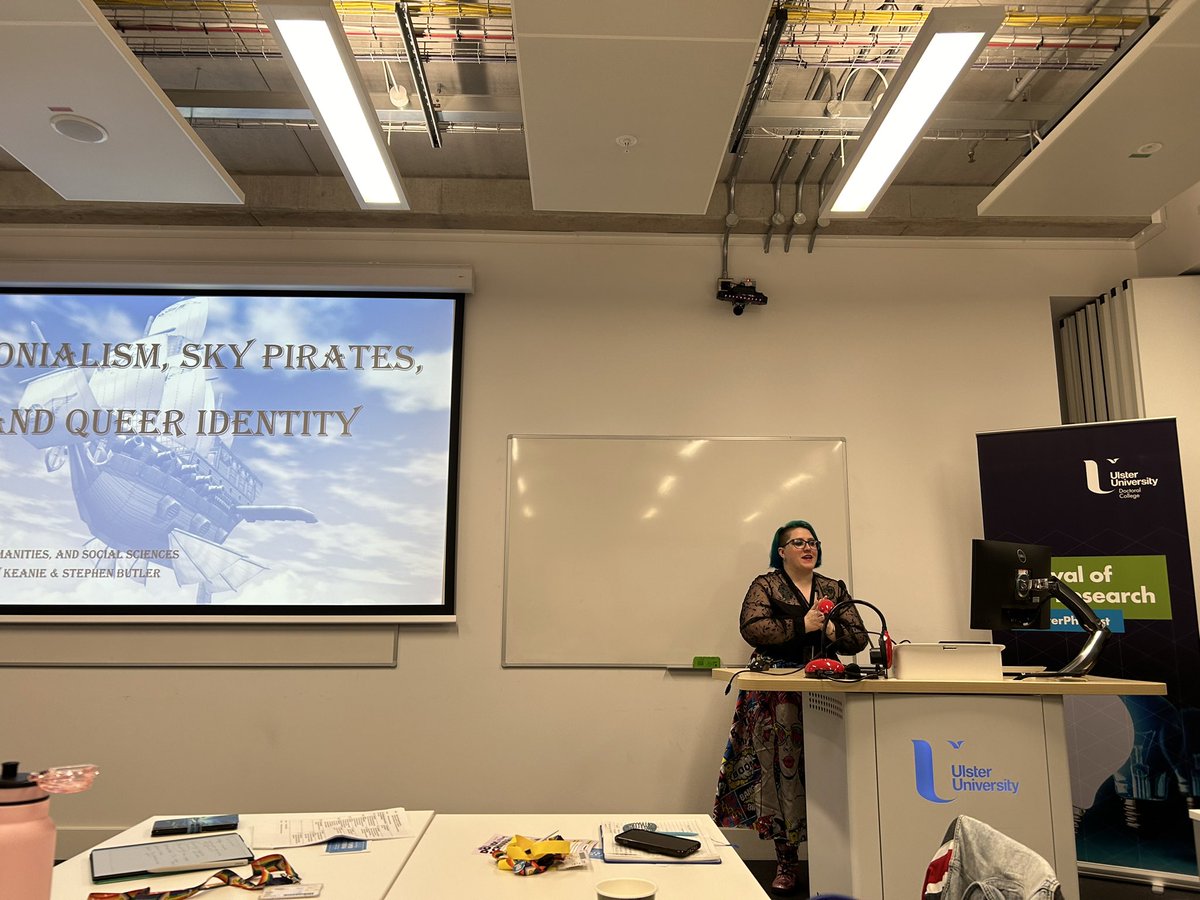 UlsterUniPhD's tweet image. Closing session 2A of #UlsterPhDFest was Frankie Bradley and their presentation on “Colonialism, sky pirates, and queer identity” - and they treated us to a reading of an excerpt of their novel!
