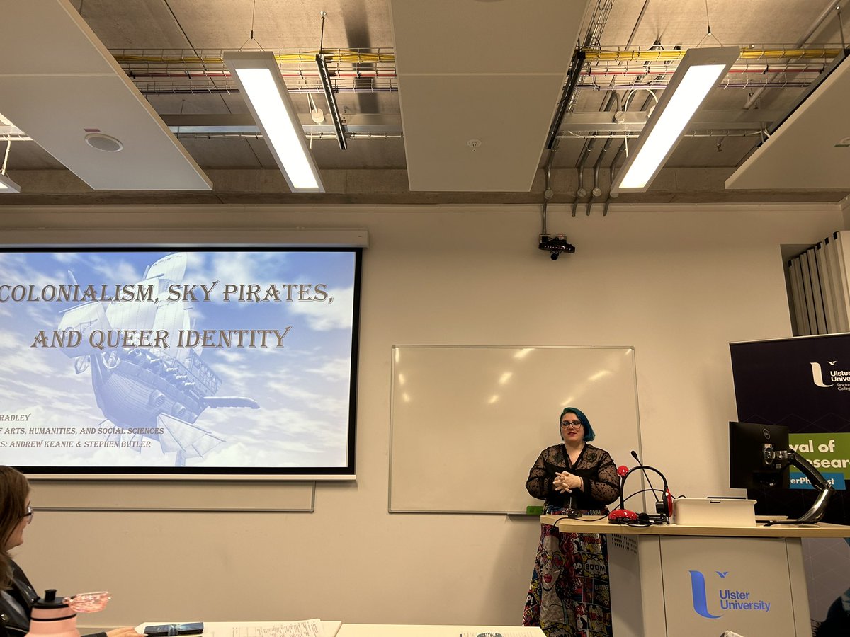 UlsterUniPhD's tweet image. Closing session 2A of #UlsterPhDFest was Frankie Bradley and their presentation on “Colonialism, sky pirates, and queer identity” - and they treated us to a reading of an excerpt of their novel!