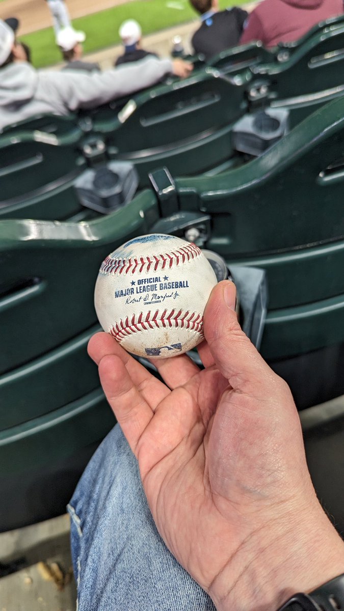 Caught a ball at the baseball game last night. Took a photo of it and then gave it to a little kid in the row in front of me.