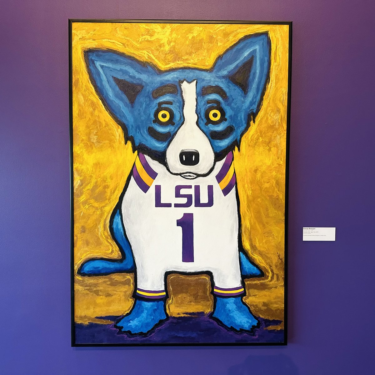 lsumoa's tweet photo. 🐯 Calling all Tiger Fans! 💙 George Rodrigue’s iconic “Number One Tiger Fan” Blue Dog painting is on display in the lobby of the LSU Museum of Art! Come experience the spirit of the LSU Tigers up close and grab a sticker as a special treat, while supplies last. Geaux Tigers! https://t.co/Xkpe3jskV1