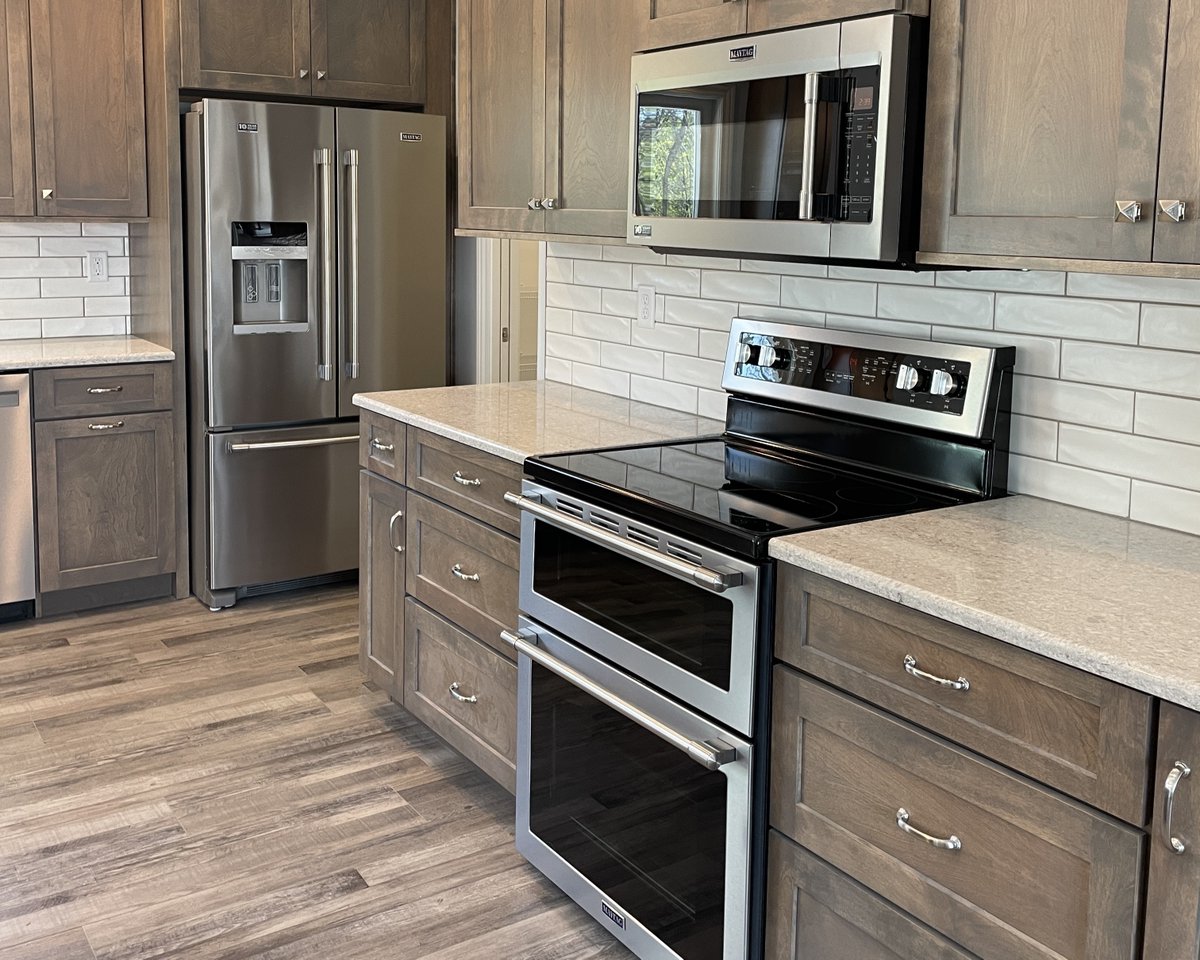 Well would you look at that, a new kitchen feature with Maytag appliances in it... and during Maytag Month. What a coincidence bit.ly/maytag-kitchen Shown: Koch Savannah Birch Driftwood kitchen by Village Home Stores for Hazelwood Homes