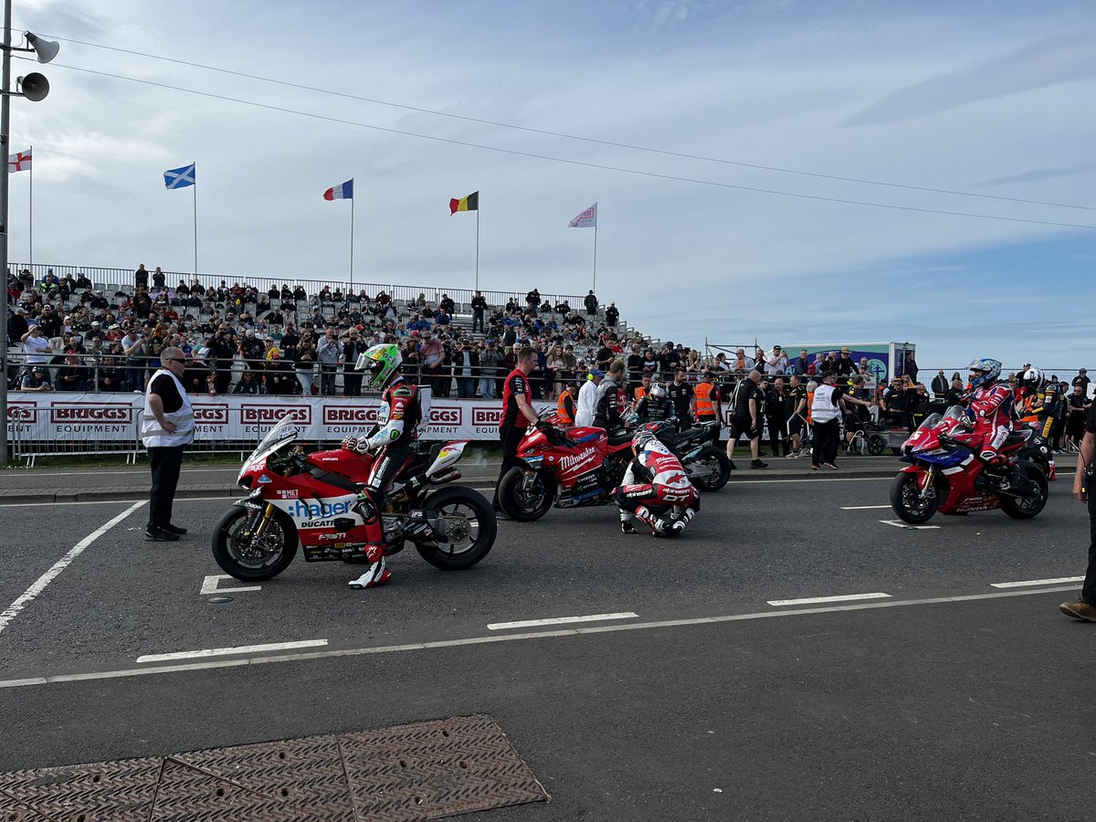 Clear the grid! Superbikes heading off on their warmup lap.