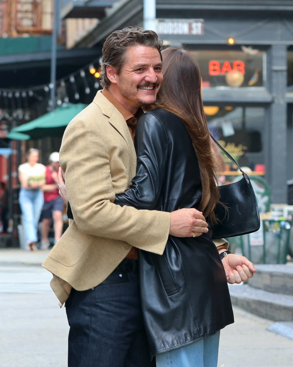 So this is what my boyfriend's been up to when he's not with me. 😭 Pedro Pascal and Dakota Johnson on the set of 'Materialist' in NYC. (📷: Getty)