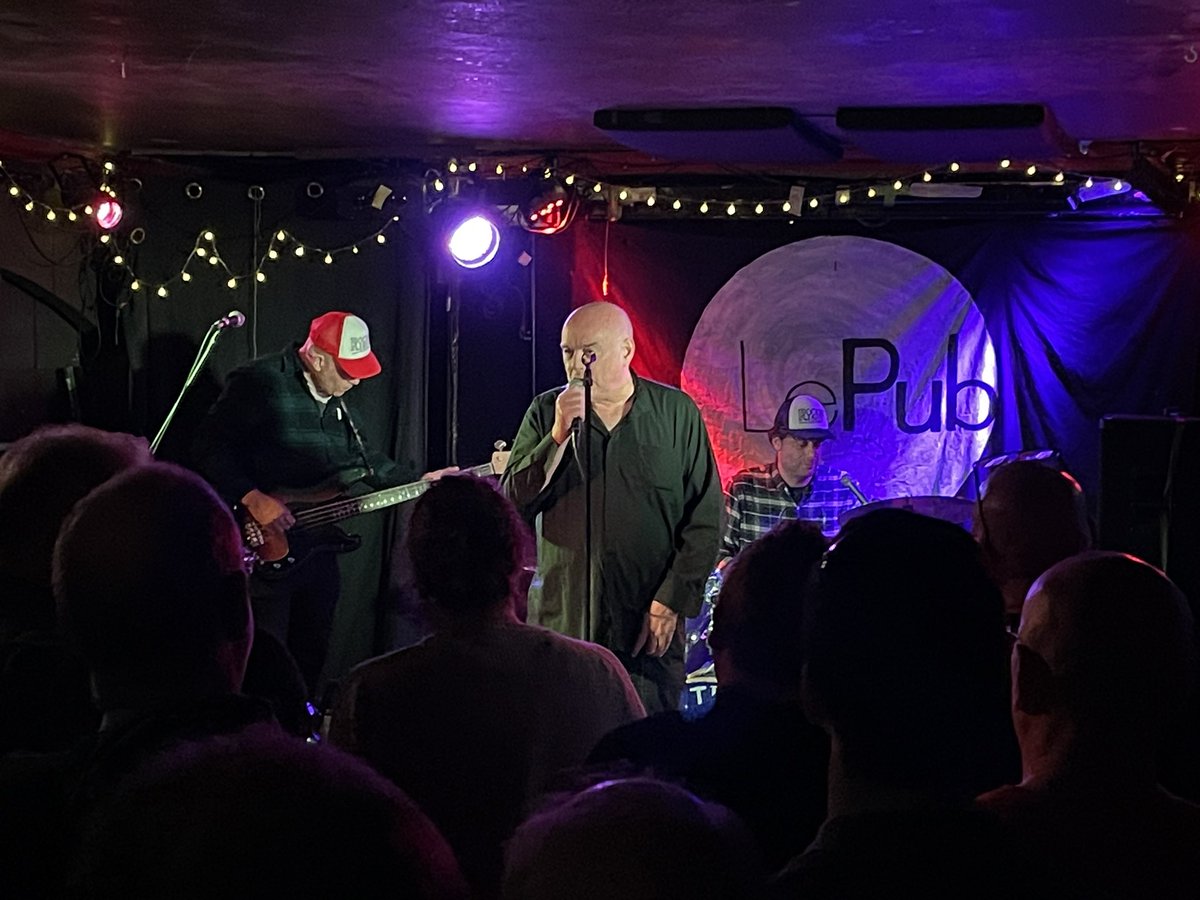 It was a bit busy and packed at The Nightingales gig at Le Pub, Newport tonight but they didn’t disappoint (nor did Ted even without “Rocking With Rita”!). Managed to snag a photo with 3 legends at the end…. Robert sandwiched between Jon Langford and the Darling Buds Matt Gray!