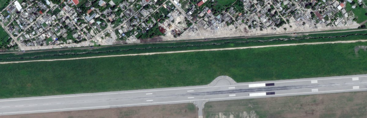 Ahead of the arrival of U.S. troops at Toussaint Louverture International Airport, the Haitian police demolished dozens of houses near the airport's walls to establish a “buffer zone.” You can see it very clearly on these <a href="/planet/">Planet</a> satellite images from April 7 and April 30.