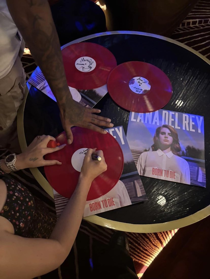 lana signing 'born to die' vinyl at the club is the most lana del rey thing she could do