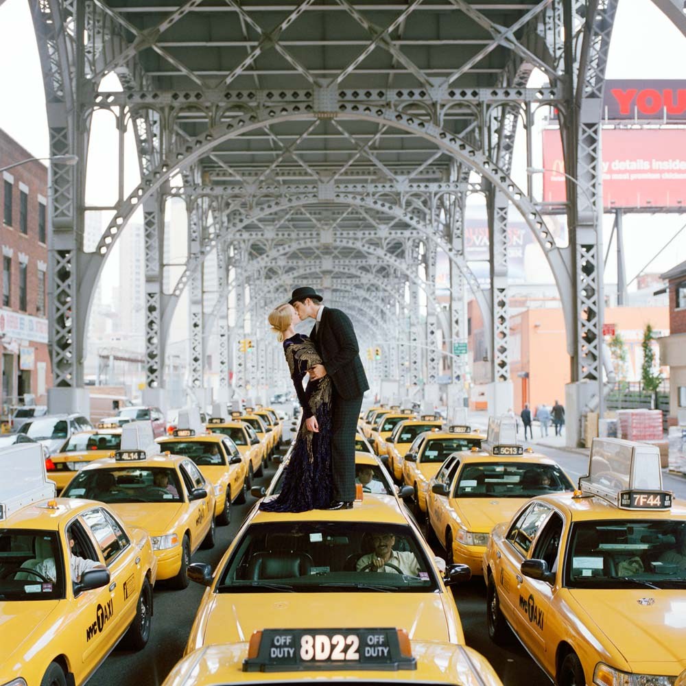 Rodney Smith Edythe and Andrew kissing on top of taxis. New York 2008