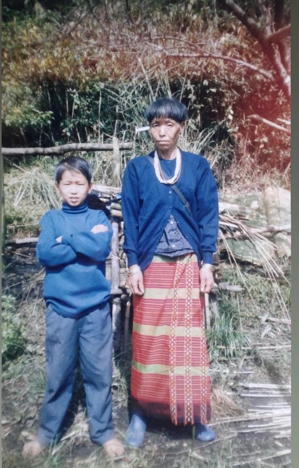 This is the last photograph I had with Mummy, way back in 2002. 

Our village school teachers took the picture when I passed my 5th standard from primary school. 

I barely remember; only a single teacher used to run the entire school, and eventually, all the students got passed.