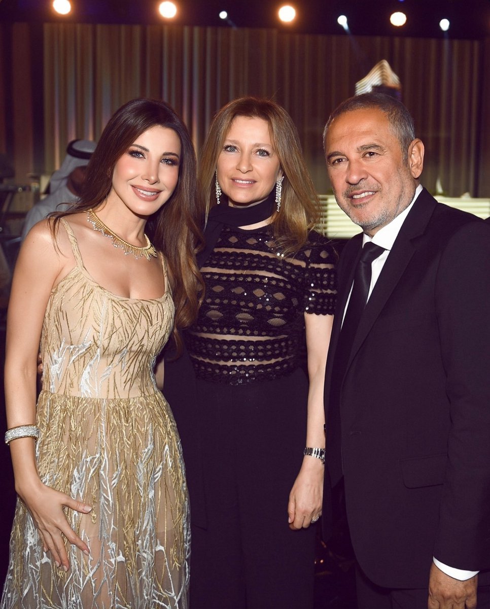 Our gorgeous Nancy Ajram with the international designer Elie Saab and his wife last night in Abu Dhabi 🤩!