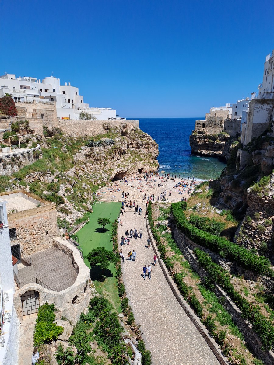 Overview of 'Lama Monachile' from the 19th century bridge in Polignano a Mare, Italy. 🏖️ #rickwesley #richkids #polignanoamare #apulia #lamamonachile #bridge #beach #sea #relax