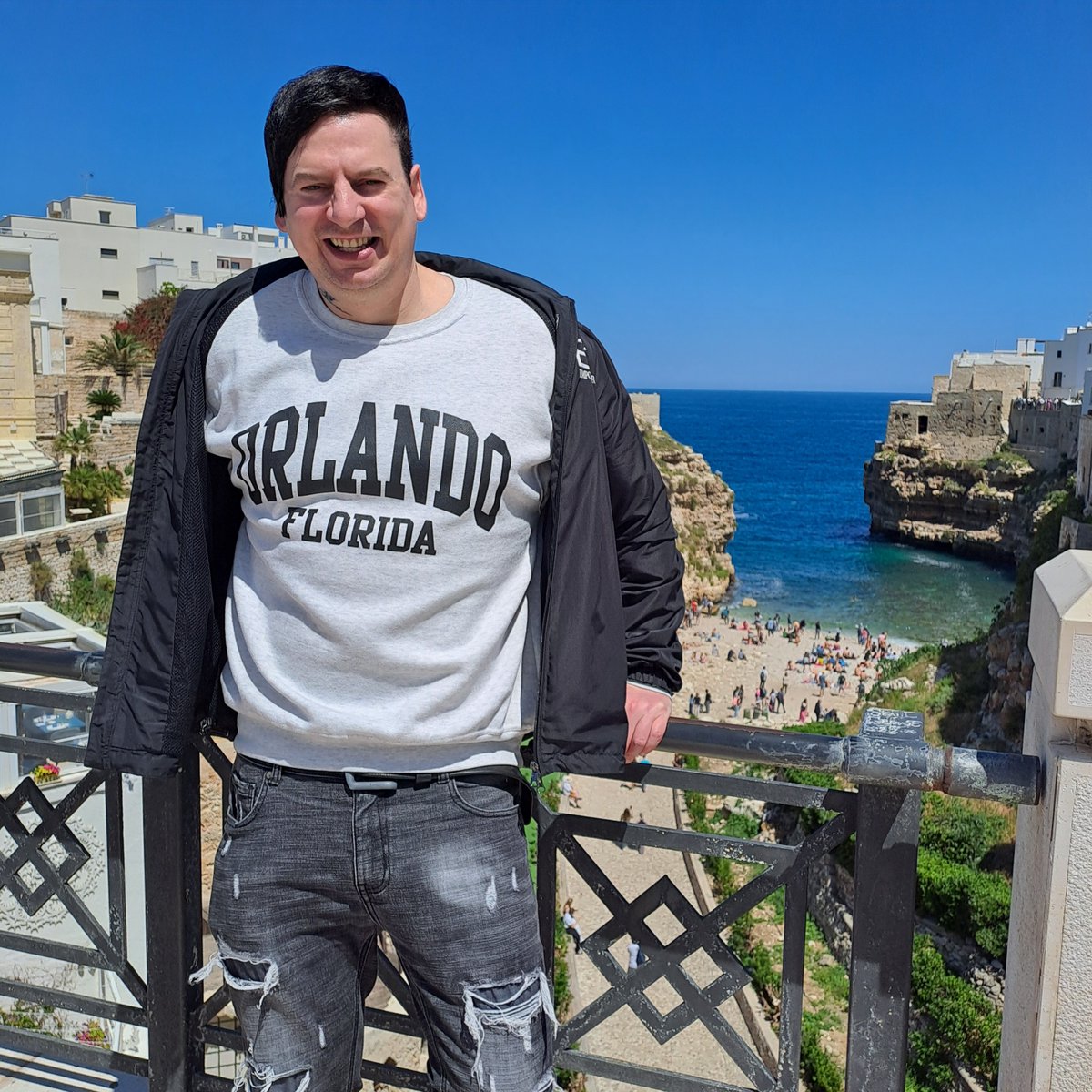 Rick is enjoying the view of 'Lama Monachile' from the 15 meter high 19th century bridge built by the Bourbons in Polignano a Mare, Italy. 🧒🏖️ #rickwesley #richkids #polignanoamare #apulia #lamamonachile #bridge #beach #sea #relax