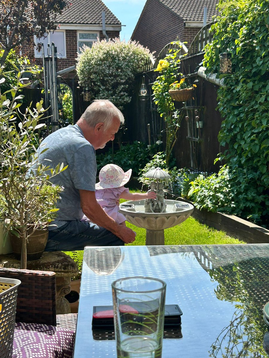Just a baby girl and her great-granddad enjoying the sun