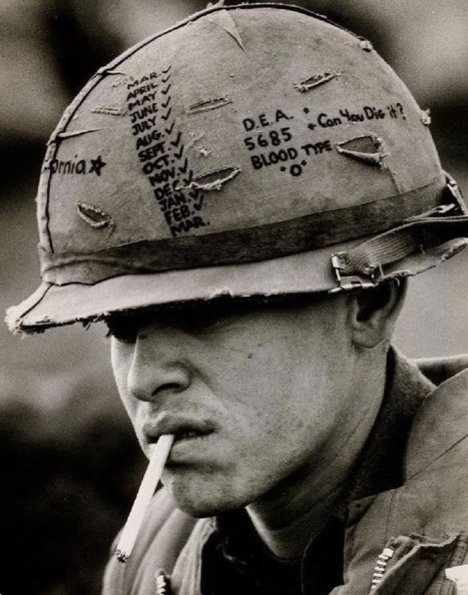 Marine Lance Corporal Ernest Delgado at Khe Sahn, Vietnam, 1968. Note his blood type and Tour of Duty countdown calendar on his cover, with 'California' across front.