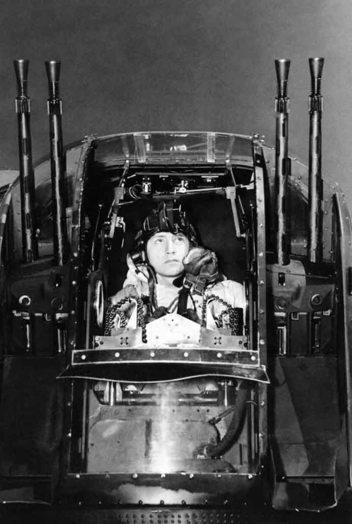 Flight Sergeant J Morgan, the rear gunner of an Avro Lancaster of No. 630 Squadron RAF at East Kirkby, Lincolnshire, checks his guns before taking off on a night raid on the marshalling yards at Juvisy-sur-Orge, France, on April 18, 1944. #History #WWII